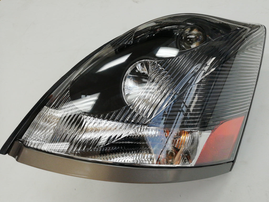 (18425-L/R) Volvo VNL 670 / 730 / 780 Black Projector Headlight ('03-'17)